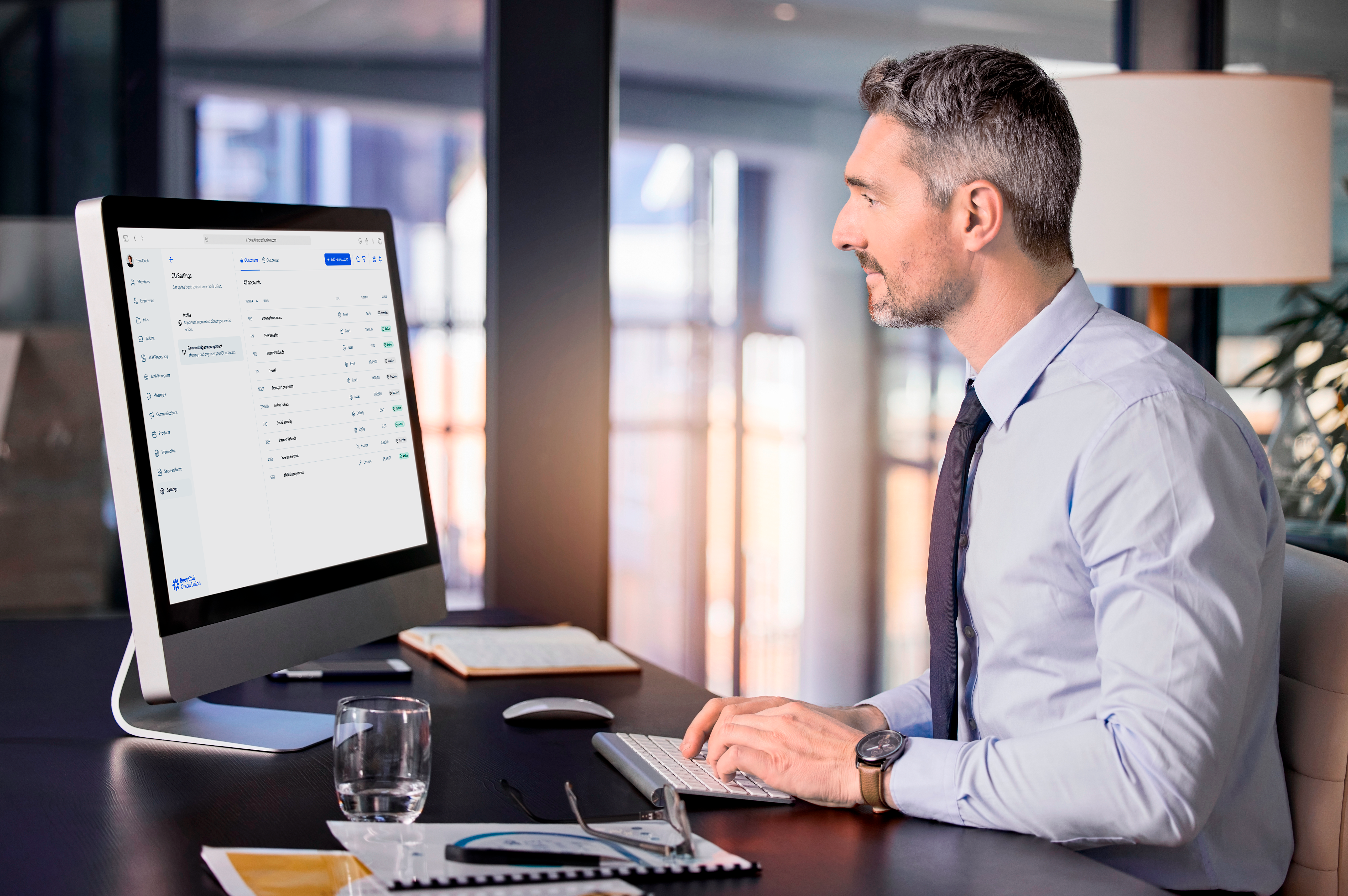 man is looking at his computer